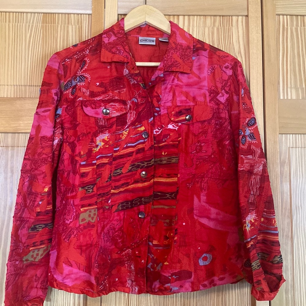 Chico’s red with pretty design jacket size one.